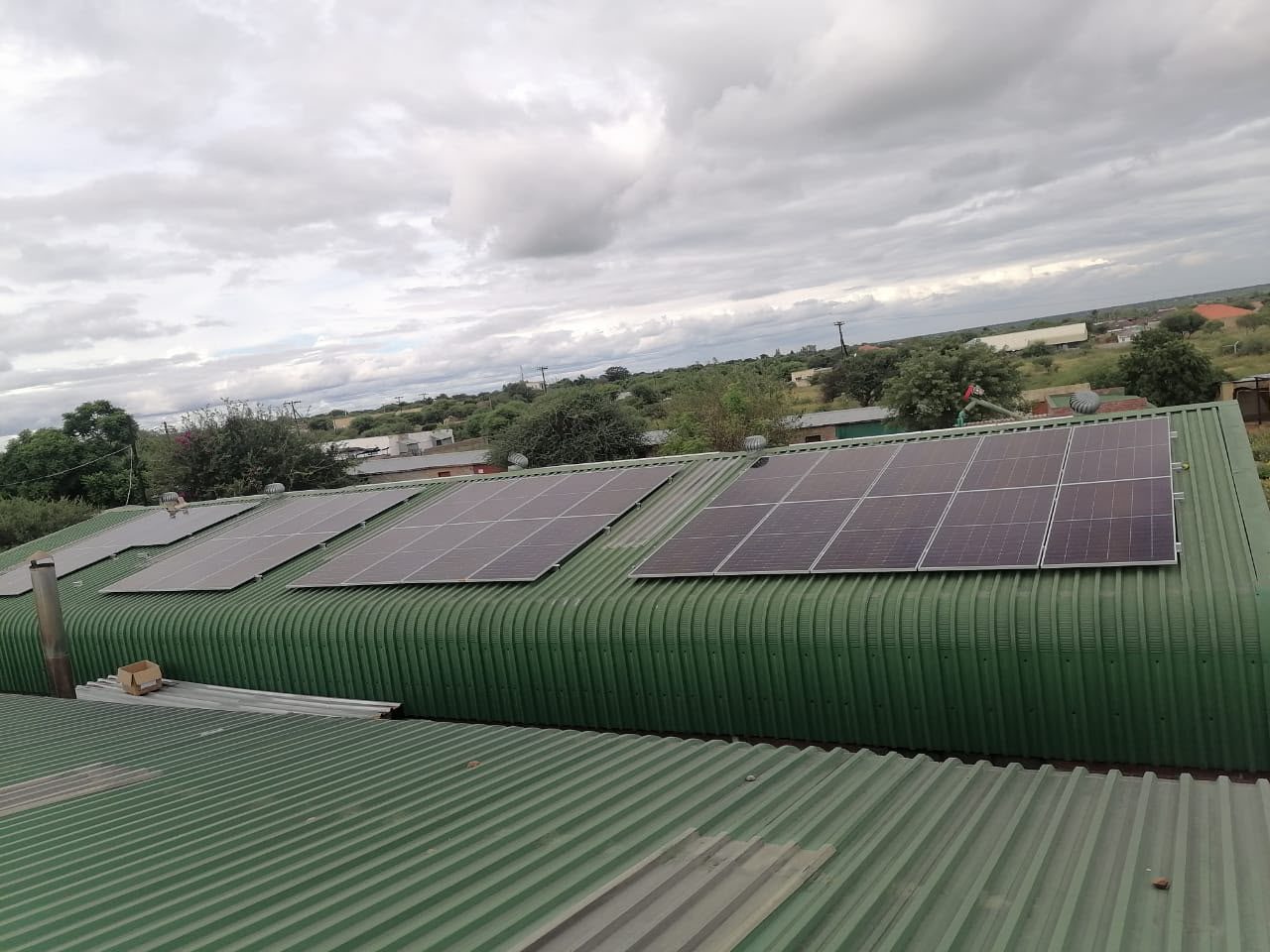 Sheeted-roof photovoltaic array at an agricultural building